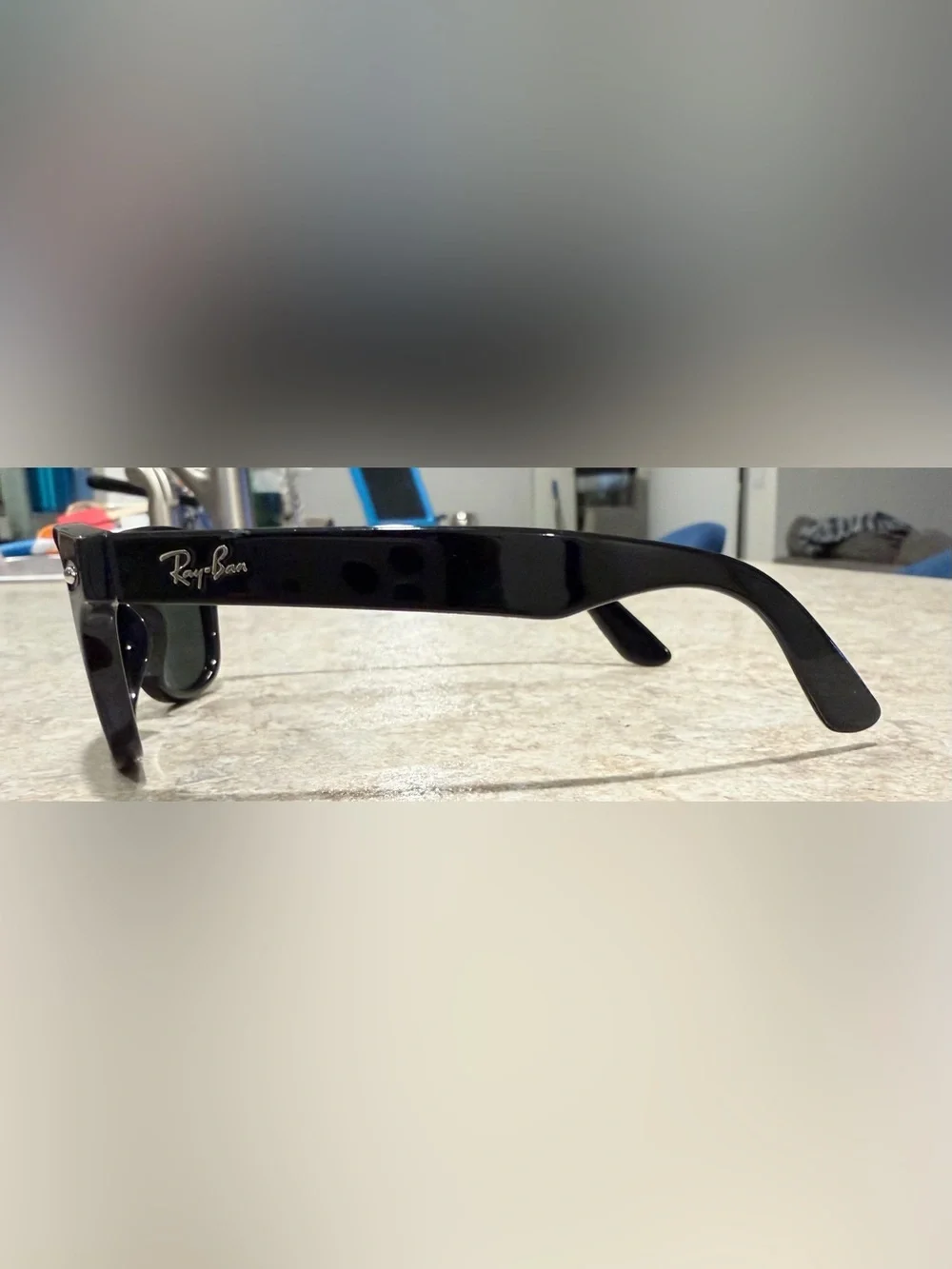 Ray-Ban RB9035S Kids sunglasses featuring a black frame and distinctive green